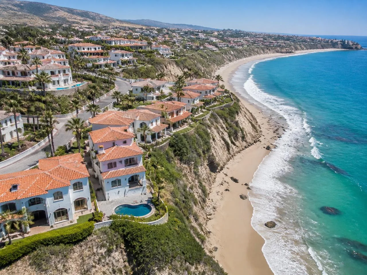 Las Gaviotas villas along the bluff above a sandy beach